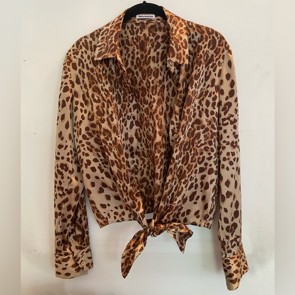 Leopard print silk tie bottom blouse from Reformation.
